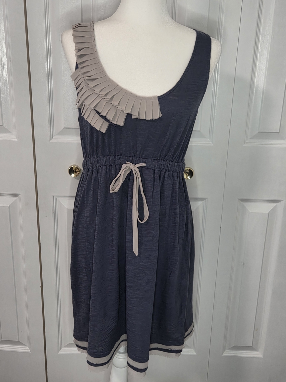 Eloise Sleeveless Navy Dress with Dark Cream Ruffle Detail